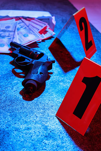 Gun, cash and evidence markers for Murder Charges page