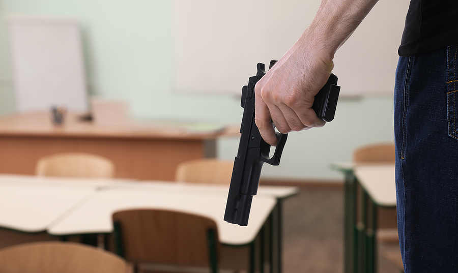 man with gun shooting in school, problem of permit less concealed carry gun